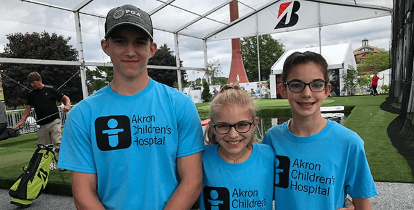 kids smiling in Akron Children's shirts